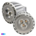 Two silver Sunflower II LED Light bulbs face the camera, each displaying three circular elements behind clear lenses. The bulbs have ribbed sides for heat dissipation and notched edges. Three small colored circles are in the lower left corner. Read more at Aerovex Systems (aerovexsystems.com)