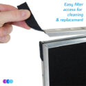 A hand peels back a Velcro strip from the metal edge of an Aerovex Dust Plus vent filter housing. Blue text reads, “Easy filter access for cleaning & replacement.” Three small colored circles are in the bottom left corner on a white background. Read more at Aerovex Systems (aerovexsystems.com)