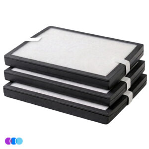 Three rectangular air filters with white centers and black borders are stacked neatly on top of each other for the Filter Multi-Pack for the Aerovex Wall Mounted Air Purifier. Each filter has a white pull tab on one side for handling. The background is plain white, and three colored dots appear in the bottom left corner. Read more at Aerovex Systems (aerovexsystems.com)