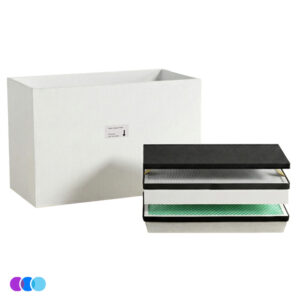 A filter set for an Aerovex Whisper™ source capture system. A large white rectangular box filter stands upright behind three stacked rectangular filters with black, gray, and green surfaces. The top filter has a black cover, and there’s a small label on the white box. The background is plain white. Read more at Aerovex Systems (aerovexsystems.com)