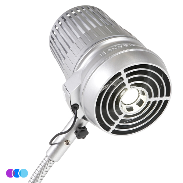 A close-up of a silver, Aerovex Sunflower II Nail Dust collector with LED spotlight with a vented cylindrical housing, circular front grille, and adjustable gooseneck arm. The light is on, emitting a bright white glow from the center. Three small colored circles appear in the corner. Read more at Aerovex Systems (aerovexsystems.com)