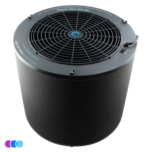 The One That Works™ Salon Room Air Purifier is a sleek, cylindrical black unit with a top-facing circular vent and “THE ONE THAT WORKS” in blue text near the edge. Three colored circles appear at the bottom left of the image. Read more at Aerovex Systems (aerovexsystems.com)