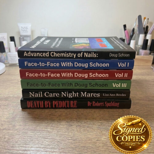 The Nail Industry Authority Bundle, featuring "Advanced Chemistry of Nails," 3 volumes of "Face-to-Face With Doug Schoon," "Nail Care Night Mares," and "Death by Pedicure," is stacked on a wooden table with a "Signed Copies" badge in the corner. Read more at Aerovex Systems (aerovexsystems.com)