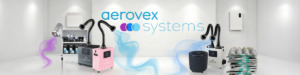 A modern white showroom displays Aerovex Systems products, including two Aerovex Systems Whisper source capture systems (one pink, one white, one gray) with flexible arms capturing blue airflow, The One That Works air purifier, two Wall Mount Air Purifiers, shelves with filters and masks, and a Sunflower II. The logo is on the back wall. Read more at Aerovex Systems (aerovexsystems.com)