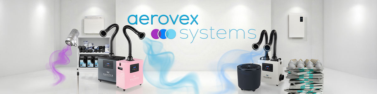 A modern white showroom displays Aerovex Systems products, including two Aerovex Systems Whisper source capture systems (one pink, one white, one gray) with flexible arms capturing blue airflow, The One That Works air purifier, two Wall Mount Air Purifiers, shelves with filters and masks, and a Sunflower II. The logo is on the back wall. Read more at Aerovex Systems (aerovexsystems.com)
